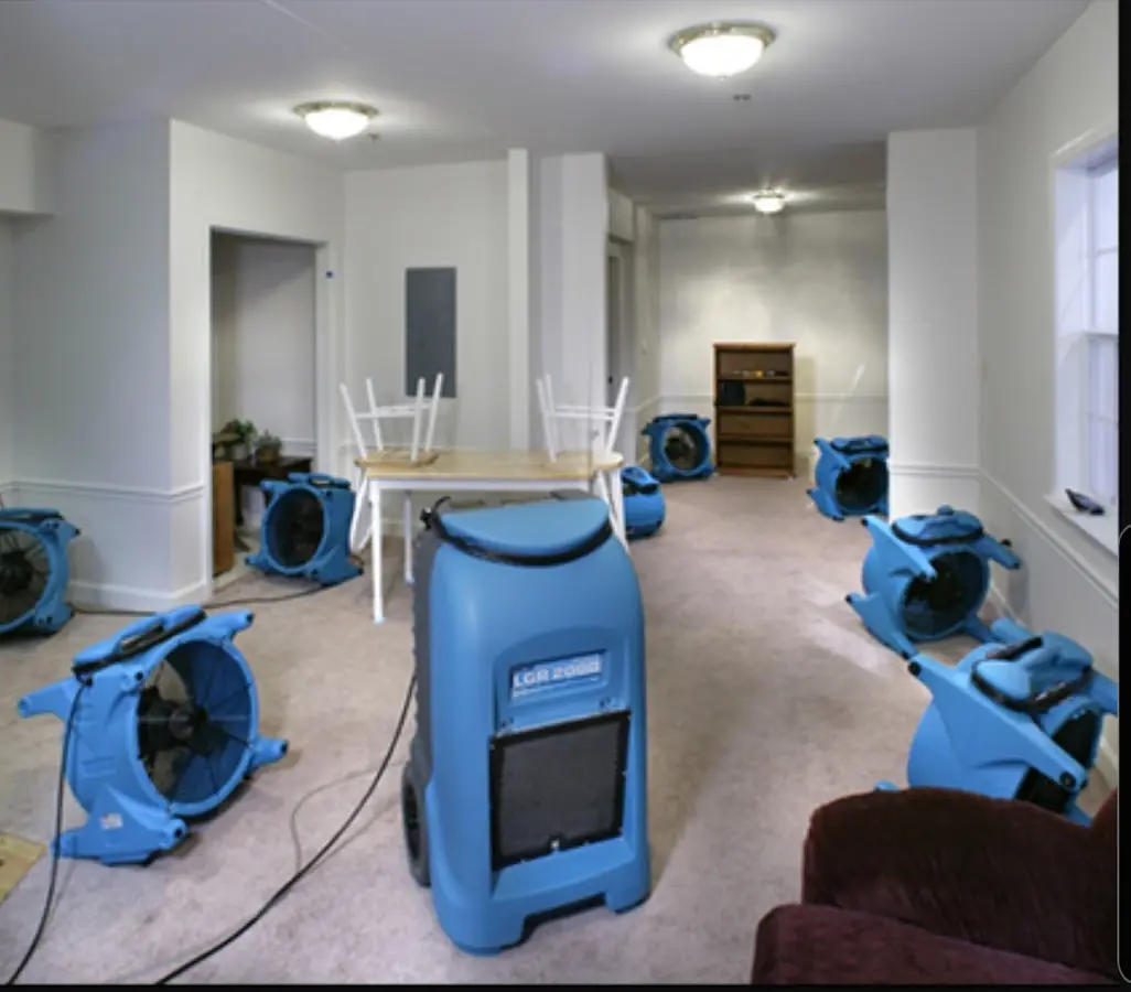 Air movers and dehumidifier setup for Water Damage Restoration in Liberty